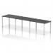 The photo captures a sleek and modern office setting with a single row of three black bench desks. The silver frames add a touch of elegance to the dynamic and spacious design of the impulse bench, perfect for a collaborative and efficient work environment.