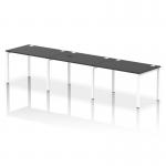 This photograph captures a sleek and modern office setup with a single row of 3-person dynamic bench desking. The white frame and black office bench desk create a sharp contrast, adding a touch of sophistication to the workspace.