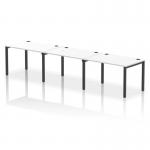 The photo captures a sleek and modern Dynamic Bench Desking Impulse Bench. This particular model is the Single Row 3 Person 1200 with a Black Frame and White Office Bench Desk. The contrast between the black and white creates a striking and professional look, perfect for any office setting.