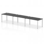 The photo showcases a sleek and modern office setup with a Dynamic Bench Desking Impulse Bench Single Row, comfortably accommodating 3 people. The 1400 silver frame contrasts beautifully with the black IB00675 bench desk, creating a professional atmosphere.