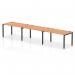 The dynamic bench desking impulse bench boasts a sleek design with a black frame and a 1400 oak office desk. This single row 3-person bench enhances collaboration and productivity while adding a touch of modernity to any workspace.