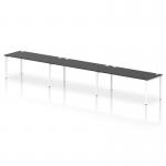 The photograph shows a sleek and modern white bench desk with a black top, designed to accommodate up to three people. The frame is sturdy and minimalist, giving off a dynamic and professional vibe. Perfect for a high-performing office environment.