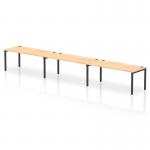 This picture features a dynamic bench desking set-up, with a single row of Impulse Bench desks accommodating three people. The black frame office bench desk is complemented by a maple finish, providing a sleek and modern look to the workspace.