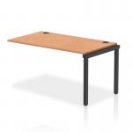 The image shows a sleek black frame bench desk with oak add-on units, extending to a length of 1400mm. The dynamic design allows for a single row set up, perfect for a modern office space.