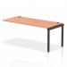 This image shows a sleek black frame bench desk with a row of single add-on units. The desk is made of beech wood and features a dynamic, modern design. It is suitable for use in an office setting.