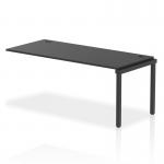 The image shows a row of sleek and modern black bench desks with add-on units, connected by an extension kit. The dynamic design adds a professional touch to any office space, with a sturdy black frame supporting the 1800mm long surface. Ideal for creating a collaborative work environment.