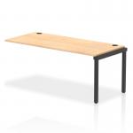 The photo features a sleek and functional Dynamic Bench Desk Add On Unit, part of the Impulse Bench Single Row Extension Kit. The unit has a black frame and is paired with a versatile maple office bench desk. Perfect for creating an organized and modern workspace.