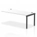 This photo features a sleek and modern office setup, with multiple Dynamic Bench Desk Add On Units and a single row extender in Black and White color combination. The 1800 Black Frame adds a touch of elegance to this functional and versatile work space.