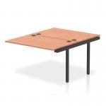 The dynamic bench desk add-on units, impulse bench B2B ext kit 1200, with a sleek black frame and a stylish beech bench desk, creates a modern and functional look for any office space.
