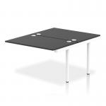 The photograph shows a white-framed, dynamic bench desk with add-on units and an impulse bench B2B ext kit. The desk is designed for use in an office setting and has a sleek and modern look with a black finish.