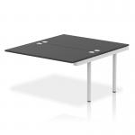 This photo showcases a sleek and modern office setup with dynamic bench desks and add-on units. The silver frame adds a touch of elegance, while the black desktop provides a professional look. The compact size of the impulse bench makes it perfect for a busy and productive work environment.