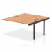 The image shows a sleek and modern bench desk with black frame and a combination of oak and white surfaces. The dynamic bench desk add-on units add extra functionality and the B2B ext kit extends the length to 1400mm. Perfect for any office space looking for a contemporary and practical workstation.