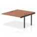 The photograph shows a sleek, modern-looking Dynamic Bench Desk with Add On Units and Impulse Bench B2B Extension Kit, all in a striking black frame. The desk is topped with a rich walnut finish, creating a stylish and professional office bench desk.
