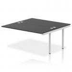 A modern office desk with a sleek silver frame and black surface. It features an add-on unit and an extension kit for added versatility. The dynamic design of this bench desk makes it perfect for any corporate setting.