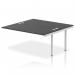 A modern office desk with a sleek silver frame and black surface. It features an add-on unit and an extension kit for added versatility. The dynamic design of this bench desk makes it perfect for any corporate setting.