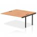 The image shows a sleek and modern office bench desk with a black frame and oak tabletop. Additional dynamic bench desk add on units are seen attached to the main desk, providing extra workspace. This versatile and practical desk is perfect for any office setting.