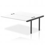 This photo features a sleek and modern dynamic bench desk, complete with add-on units, an impulse bench B2B ext kit, and a black frame. The office bench desk has a white finish, creating a clean and professional look.