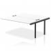This photo features a sleek and modern dynamic bench desk, complete with add-on units, an impulse bench B2B ext kit, and a black frame. The office bench desk has a white finish, creating a clean and professional look.