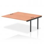This picture shows a practical and modern office setup with Dynamic Bench Desk Add On Units. The Impulse Bench B2B Ext Kit 1800 features a sleek black frame and is paired with a stylish beech bench desk. Ideal for a productive work environment.