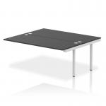 The photo shows a modern and versatile office bench desk with a sleek silver frame and black add-on units. Its dynamic design and extended length make it perfect for a productive and stylish workspace.