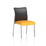 The photo shows a visitor at the Dynamic Visitors Academy sitting on a nylon back, bespoke colour seat in Senna Yellow. They do not have arms, and are clearly participating in an activity or event at the facility. The bright yellow seat adds a pop of color to the overall scene.