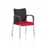 In this photograph, a dynamic visitor at the Visitors Academy is seen sitting in a comfortable black fabric chair. The back of the chair is bespoke, giving it a unique touch. The seat is in a vibrant bergamot cherry color, adding a pop of color to the surroundings.