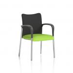 A visitor at Dynamic Visitors Academy sits comfortably in a black fabric back chair with their arms resting on bespoke coloured armrests in myrrh green. The sleek design and comfortable seating make it ideal for long conference sessions and events.