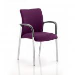 In this photo, a dynamic visitor at the Dynamic Visitors Academy is shown sitting on a bespoke tansy purple chair with their arms draped over the back and seat. The striking colour adds a pop of vibrancy to the scene.