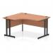 The picture shows a versatile office desk with a curved shape, measuring 1400mm on the left side. The top is made of light beech wood, and the legs are sturdy black cantilevers. This dynamic desk is perfect for any modern office space.