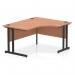 The image shows a modern office desk with a curved right side, made of beech wood and supported by sleek black cantilever legs. The spacious surface provides ample room for work, while the dynamic design adds a touch of style to any workplace.
