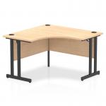This photo features a sleek and modern dynamic corner desk with a maple top and black cantilever legs. The desk is 1200mm and perfect for any office space.