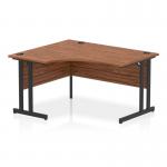 This image features a stunning dynamic left hand desk, with a sleek walnut top and sleek black cantilever leg for support. The left crescent design adds a unique touch to any office space.