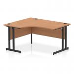 This photograph features a dynamic left hand desk with a 1400mm left crescent office desk, an oak top, and black cantilever legs. The modern design and sleek finish make this desk an attractive addition to any office space.