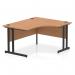 This picture features a sleek and modern Dynamic Right Hand Desks Impulse 1400mm Right Crescent Office Desk with an oak top and black cantilever leg. The clean lines and curved design create a contemporary and dynamic workspace.
