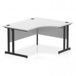 The photograph captures a sleek and modern office desk with a white top and black cantilever legs. The unique crescent shape adds a dynamic touch to the design.