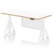 The photo features the sleek and modern Dynamic Sit Stand and Height Adjustable Desks Oslo 1600mm. The desk has a white top with a natural wood edge and is supported by a white frame. It also has a white steel modesty panel and is equipped with a Piste Foot for extra stability. This versatile desk is perfect for any office space.