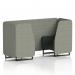 The image shows a sleek and modern 2-seater booth with black legs, featuring dynamic seating for maximum comfort. The booth is covered in a rivet fabric and the panels are made of vitreous material. The charcoal sofa adds a touch of elegance to the design.