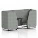 This photo showcases two sleek and modern Brixworth seating booths with black legs and a coordinating black table in rivet fabric. The dynamic design features prime panels and a comfortable sofa, creating a stylish and functional seating option for any space.