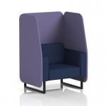The photograph showcases a sleek and modern open booth from Dynamic Booths, customized with black legs and covered in synergy fabric. The single seater is accompanied by order panels and a matching sofa, creating a cohesive and stylish seating area.