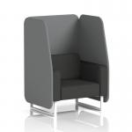 The picture features a modern and stylish open booth with sleek white legs. The booth showcases a single 1-seater seat in synergy fabric, paired with partner panels and a mix sofa for a dynamic and customizable seating option.
