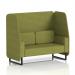 The photograph captures a stylish and modern open booth with black legs in rivet fabric, accented with olive panels and a coordinating sofa. This made-to-order piece from Dynamic Booths offers both functionality and aesthetic appeal.