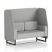 The photograph features a dynamic booth, custom-made in Brixworth with Sumi fabric and Tokyo panels. Its sleek black legs support a 2-seater open booth, complete with a matching black sofa. The booth exudes sophistication and modern style.