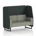 The photograph captures a sleek and modern two-seater booth with rivet fabric in charcoal panels and black legs. The open design exudes a dynamic feel, perfect for any contemporary space.