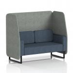 The photo showcases a sleek Brixworth 2 seater open booth with black legs, upholstered in rivet fabric. The dynamic design boasts prime panels and a stylish Crucible Sofa, creating a comfortable and modern seating option.
