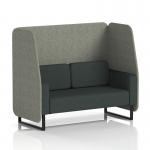 This photograph showcases a stylish Dynamic Booths 2 seater open booth with black legs, upholstered in rivet fabric and featuring vitreous panels. The charcoal sofa adds an elegant touch to this made-to-order piece from Brixworth.