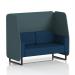 The picture shows a modern, customizable booth with sleek black legs and geometric paneling in multiple fabrics. This 2-seater design is perfect for creating a dynamic seating arrangement in any space.