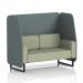 This photograph shows a custom-made two-seater open booth from Dynamic Booths, with black legs and stylish Westminster panels in a classy main line flax fabric. The booth also features a cozy Newbury sofa, creating a modern yet inviting look.
