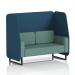 The photo features a bespoke Dynamic Booths Brixworth 2 seater open booth with black legs, upholstered in sumi fabric. The booth is complemented by uto panels and a Handa Sofa SF002130. The overall look is sleek and contemporary.