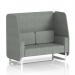 In the image, there is a modern and stylish booth with a 2-seater open design. The white legs contrast beautifully against the rivet fabric and prime panels, creating a chic and dynamic look. This custom-made piece from Brixworth is perfect for any space in need of a functional yet eye-catching seating area.