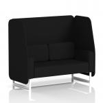 The picture shows a dynamic booth with a 2 seater open design, made to order with white legs. The booth boasts circular fabric panels in two different colors, creating an inviting and modern atmosphere. The accompanying sofa adds extra comfort and style.